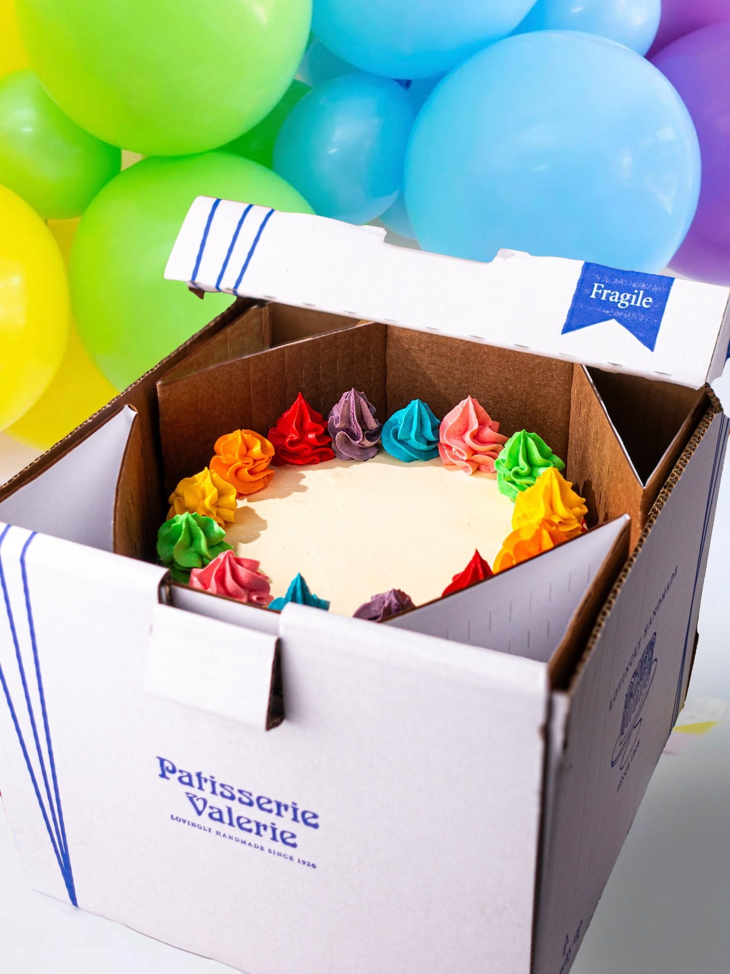 Patisserie Valerie's handmade Rainbow Cake cake delivery