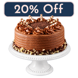 Ultimate Chocolate Layer Cake on a white cake stand, 20% Off Treat Yourself Tuesday