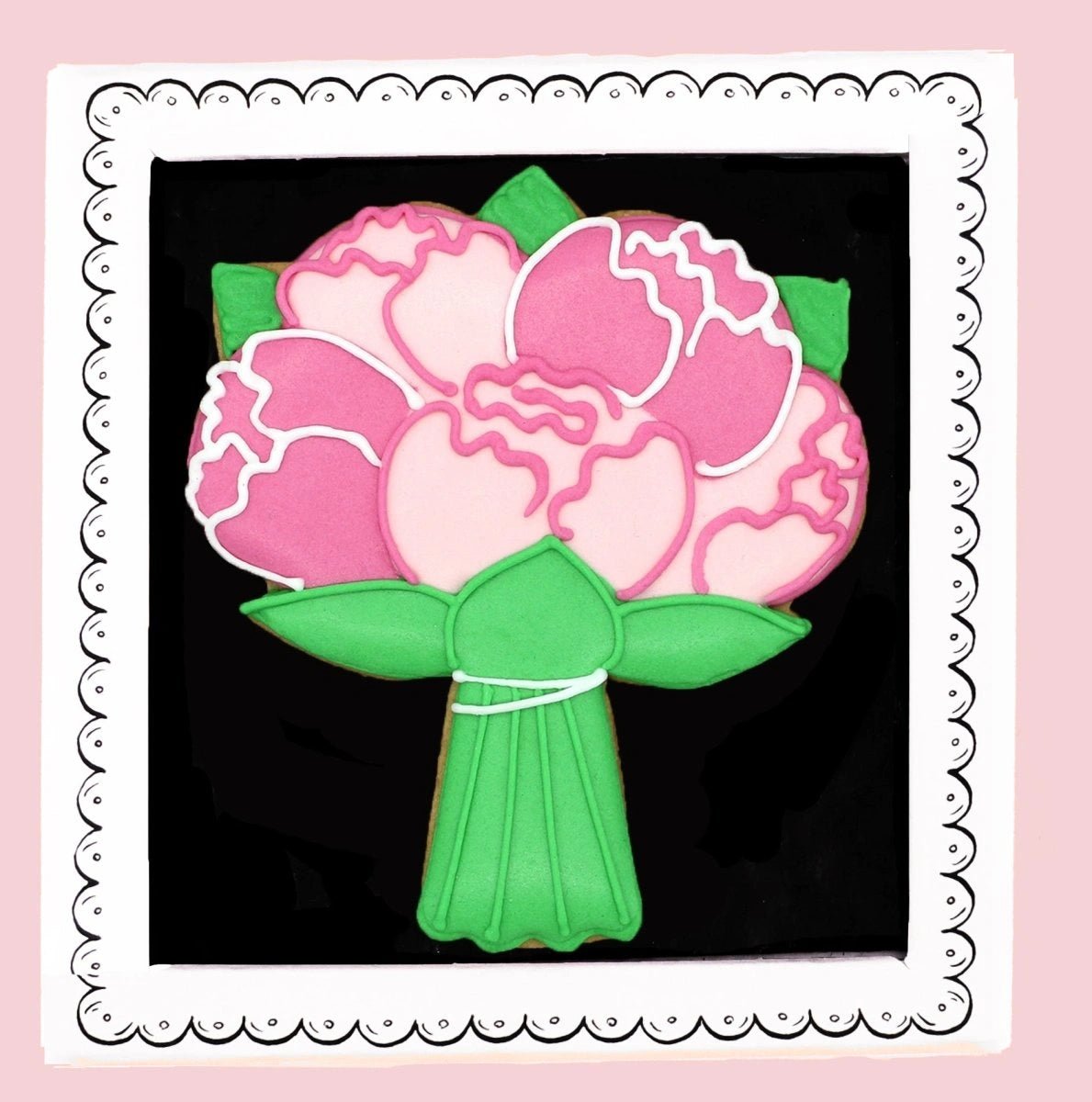 Biscuiteers Bouquet of Flowers letterbox biscuit with pink flower icing and green stems in its gift box
