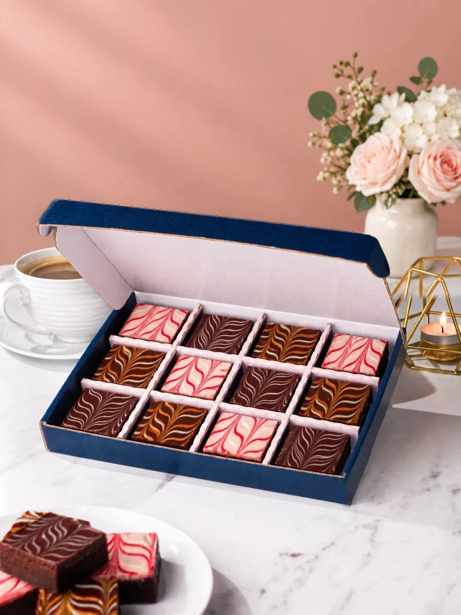 Chocolate fudge brownies in an open Patisserie Valerie gift box