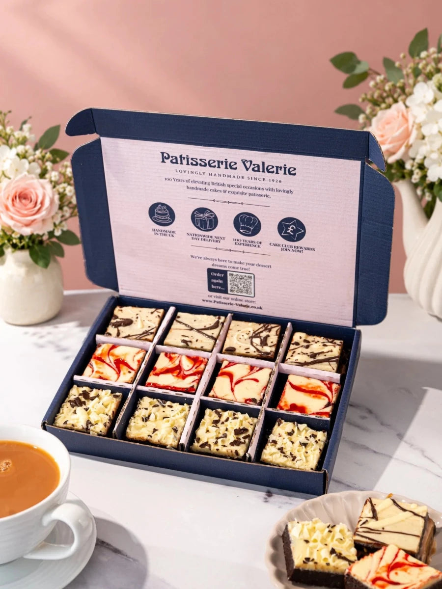 Luxury brownies arranged in rows in an open gift box from the Happy Birthday range by Patisserie Valerie