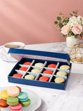 Open gift box of 12 strawberry & vanilla macarons by Patisserie Valerie