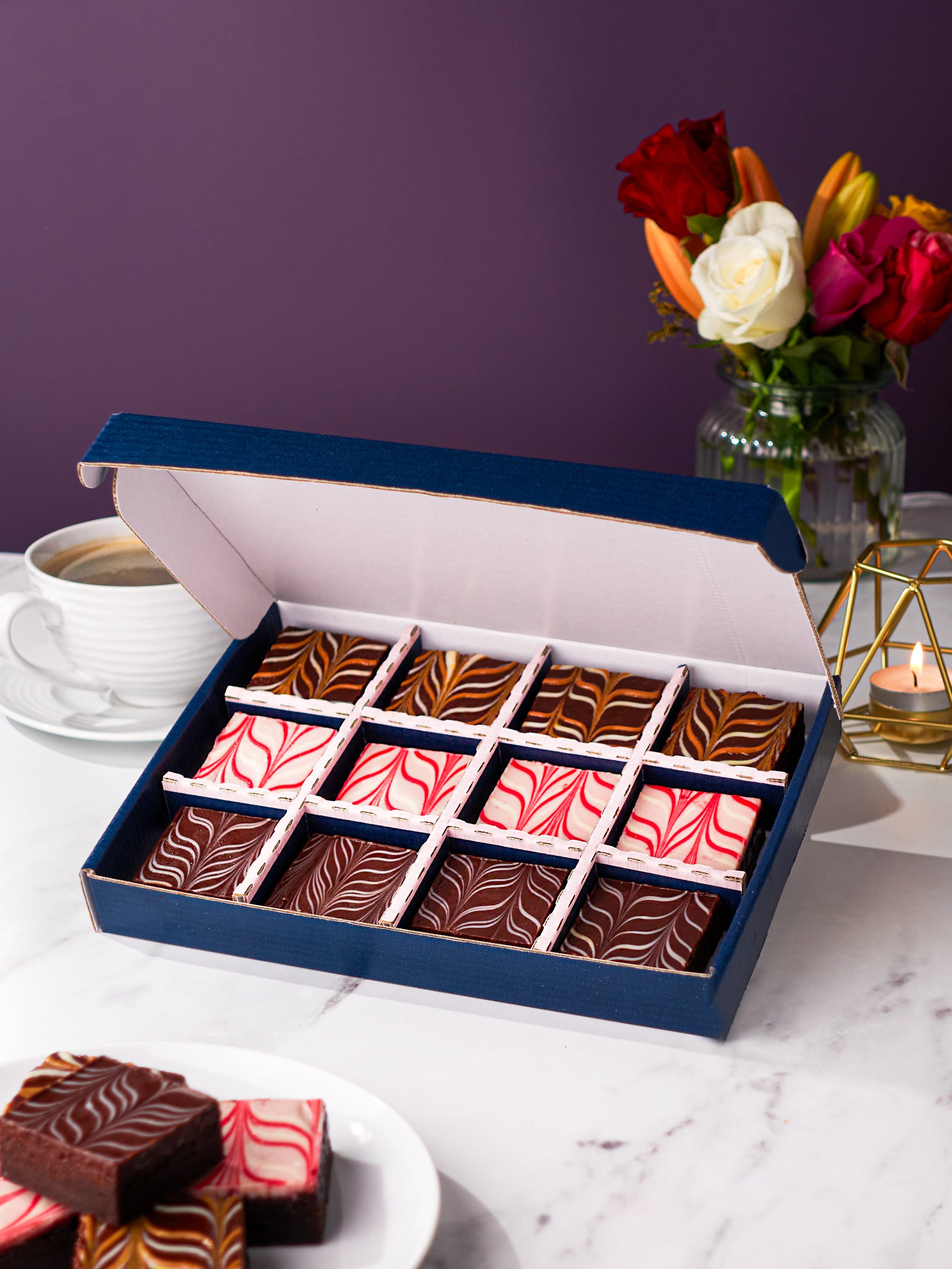 Patisserie Valerie's handmade New Baby Chocolate Fudge Brownies Gift Box opened to reveal assorted brownies