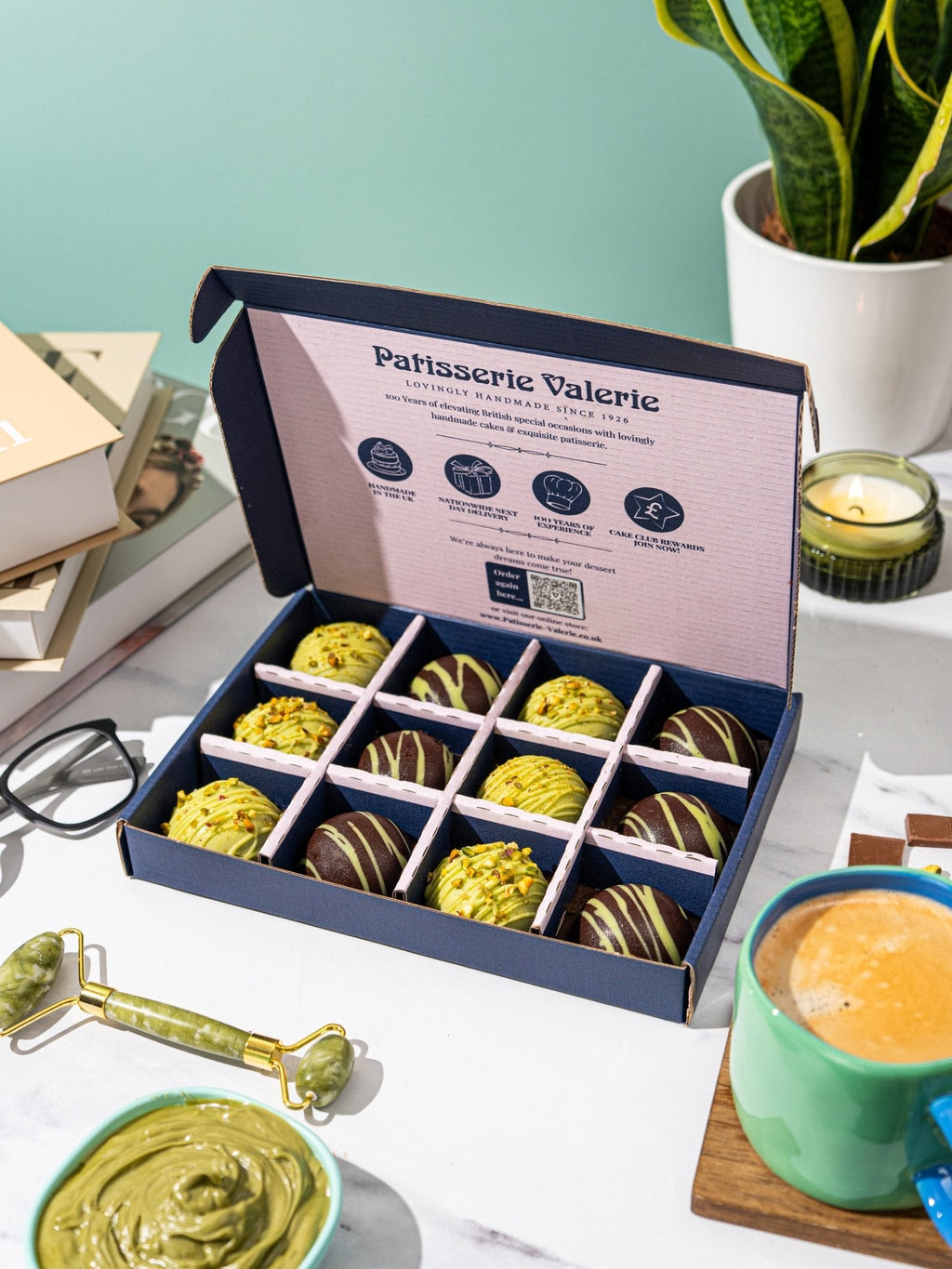 Patisserie Valerie's handmade Dubai-Style Chocolate & Pistachio Bites unboxed and cut open to show the pistachio filling