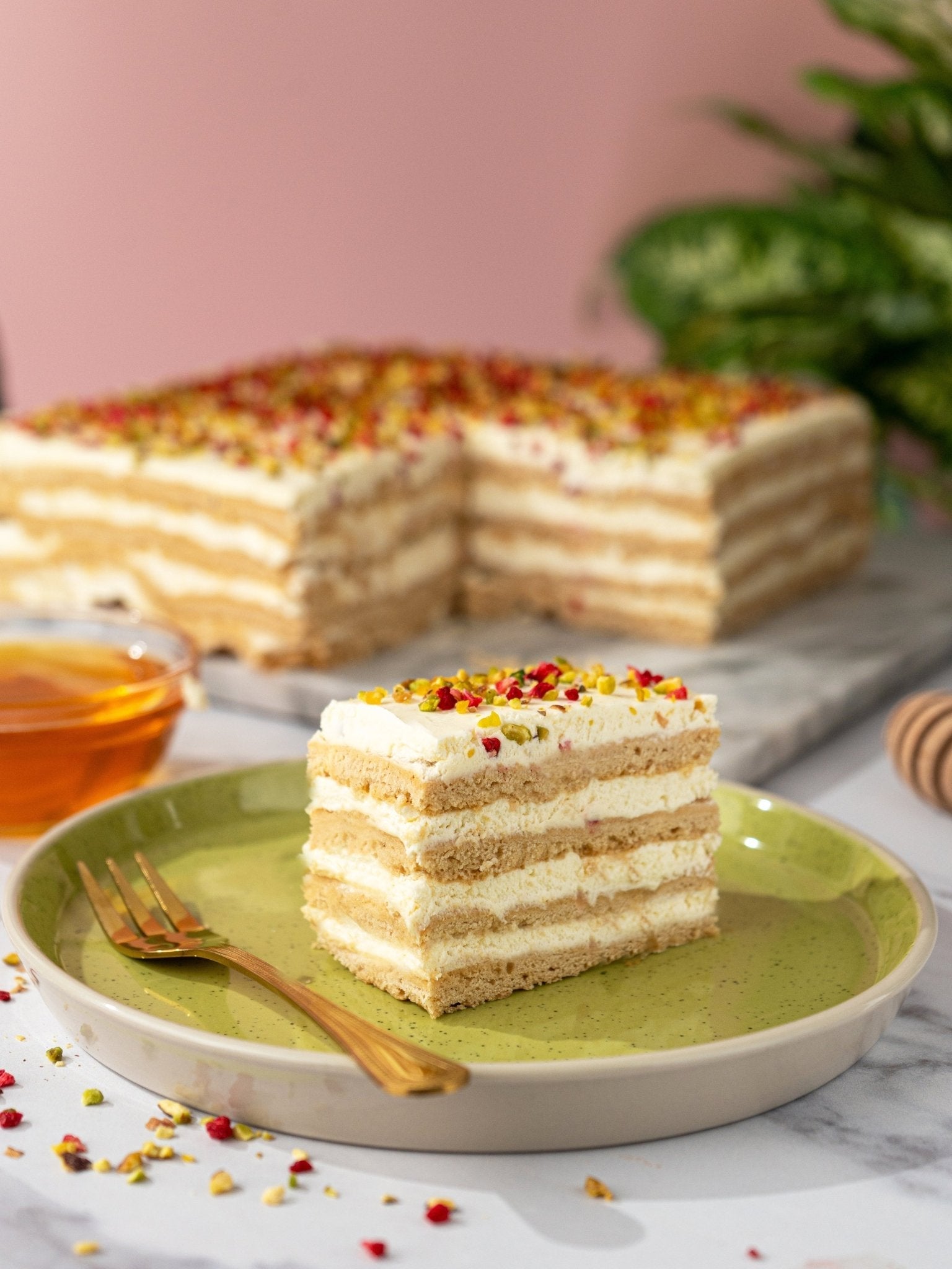 Patisserie Valerie's handmade Honey Cake being sliced and served