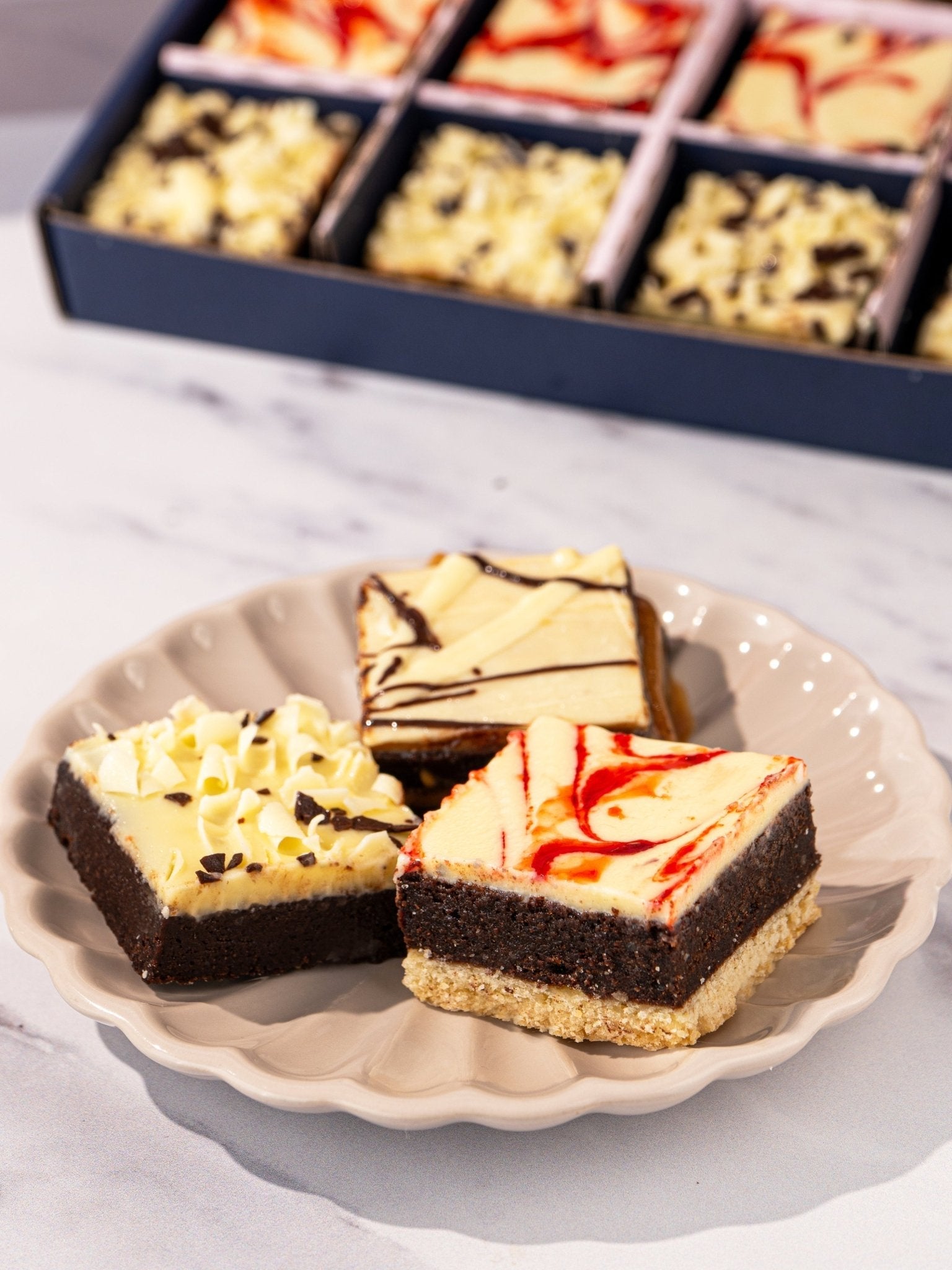 Patisserie Valerie's handmade Good Luck Luxury Brownies Gift Box being opened, brownies plated and served