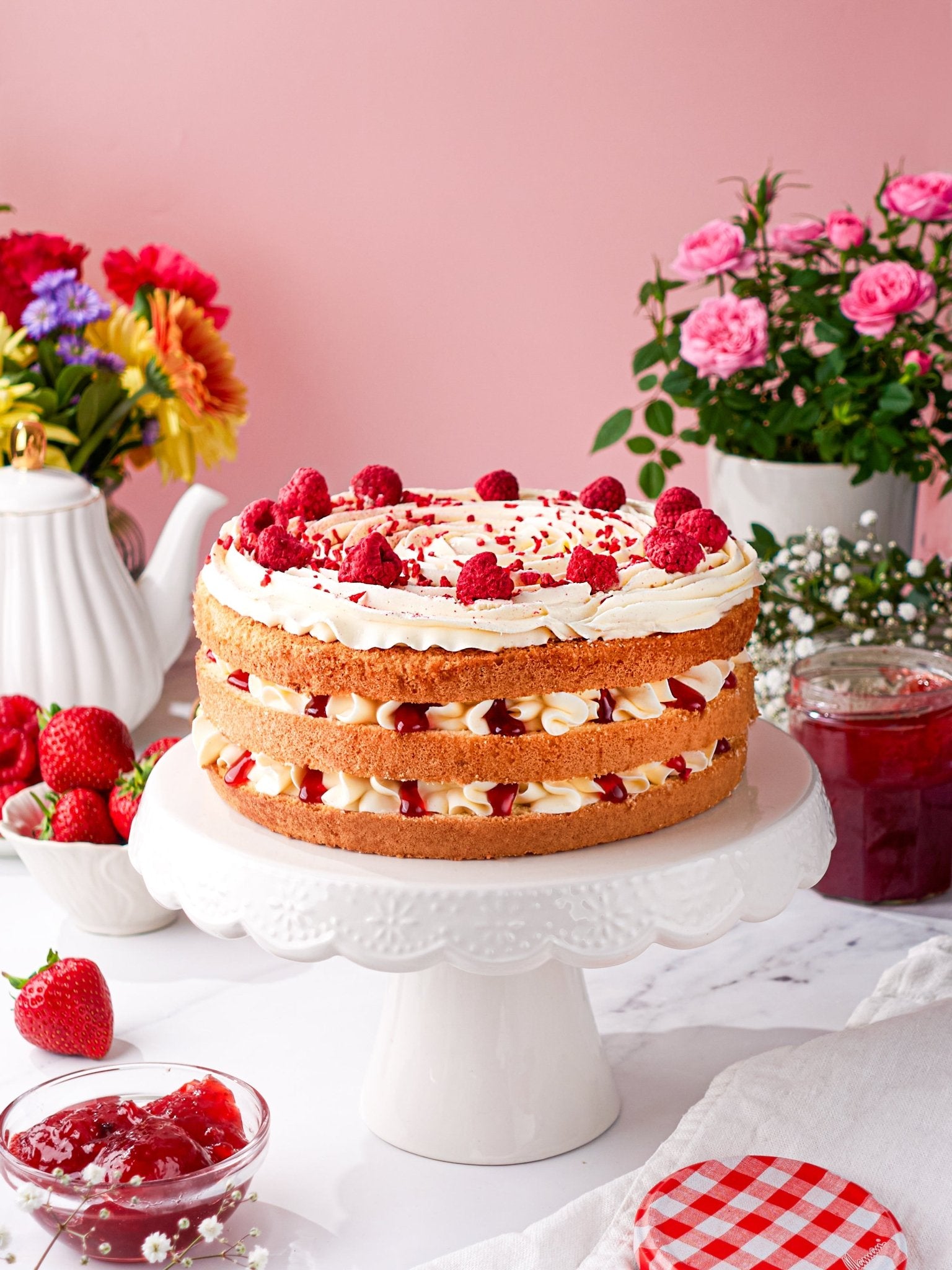 Classic Victoria Sponge cake, layered with raspberry jam and cream.