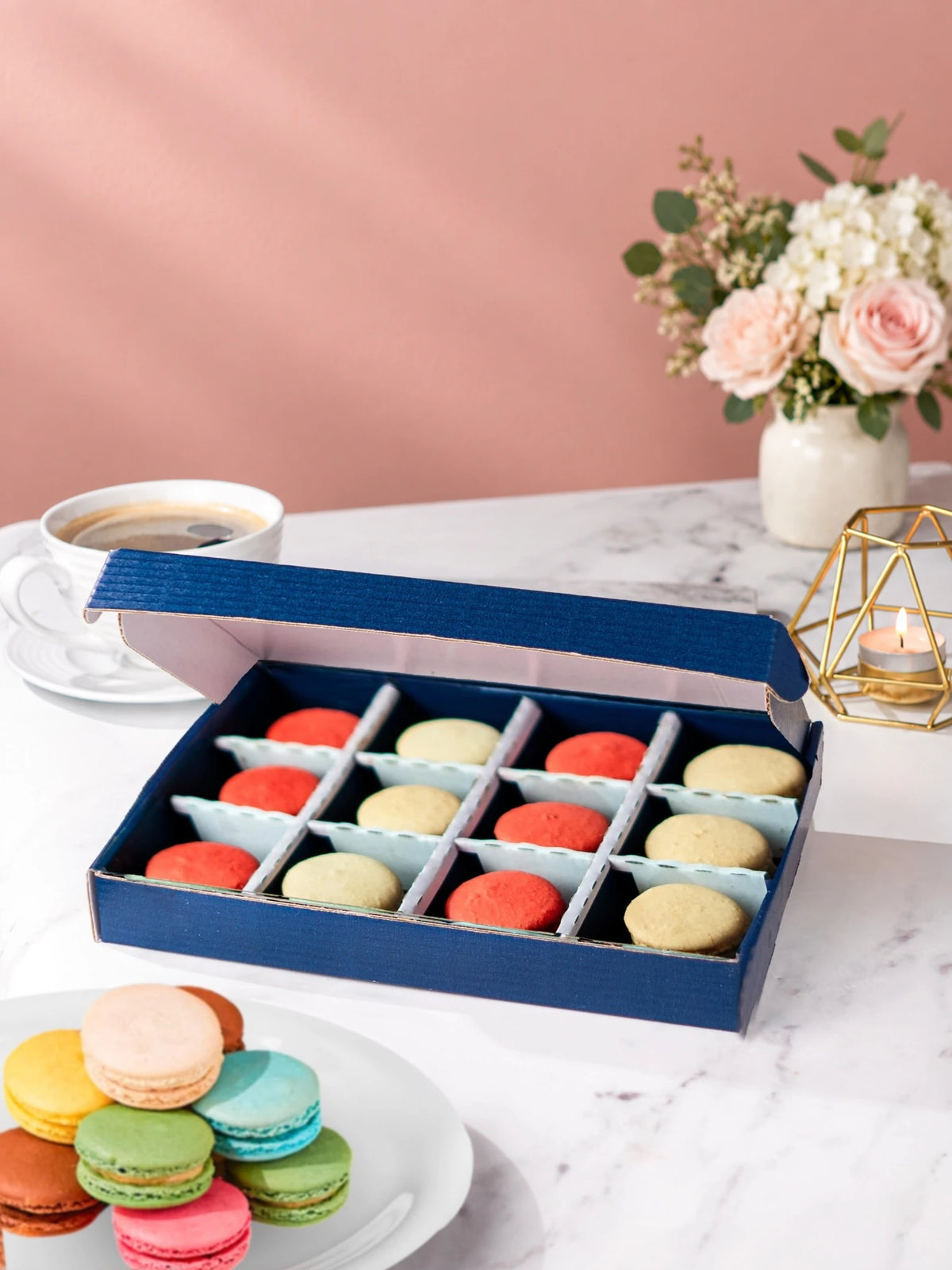 Open gift box of 12 strawberry & vanilla macarons by Patisserie Valerie