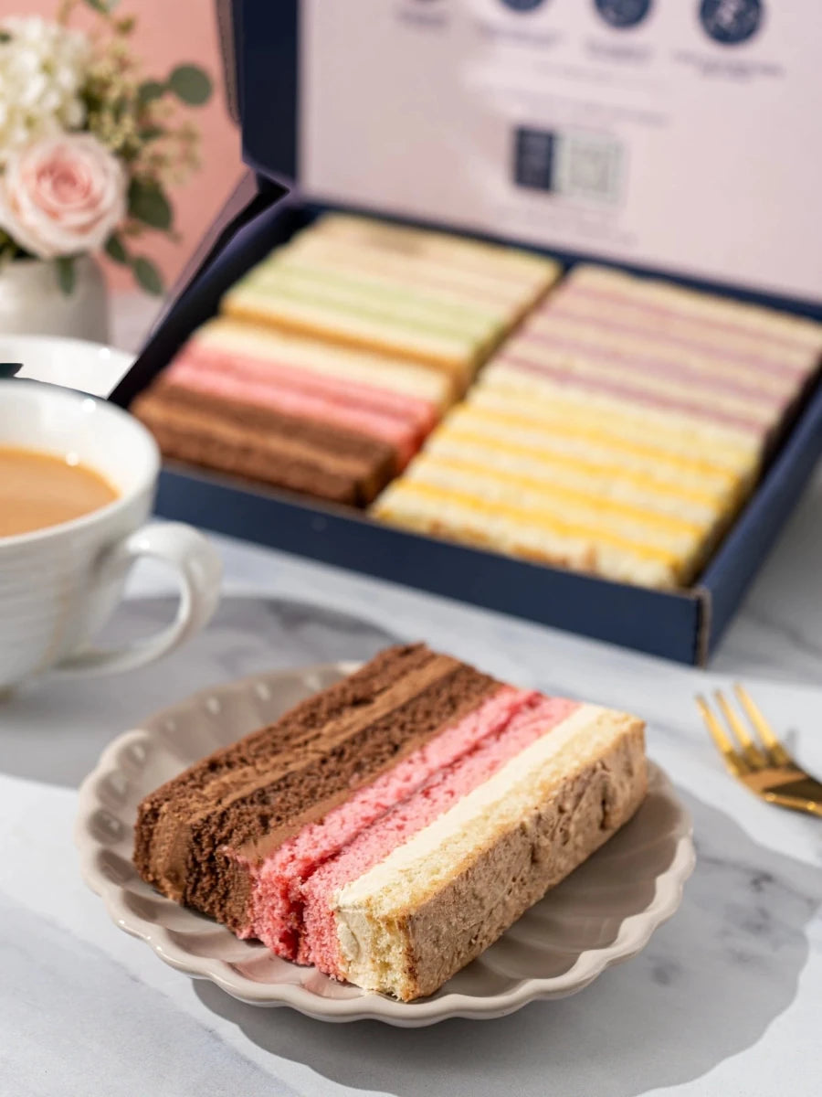 Three assorted Summer Favourites cake slices on a white plate by Patisserie Valerie